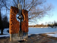 This is one of many statues and sculptures in the Star City landscape. The style is typical - very chunky and Soviet, which a heavy 'cosmos' theme. On the right are the three NASA duplex cottages, and in the distance one cn just make out the Prophylactorium where Mark Lives