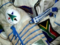 The Sokol space suit that was used by Mark throughout the training period, showing the South African flag, the FAIS logo and the nameplate in English and Russian.