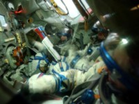 This delayed exposure shot shows the movements of the crew in the Soyuz simulator during the final test.