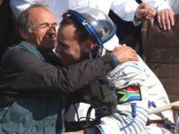 Mark's father, Rick, gives his cosmonaut son a great big welcome home hug.