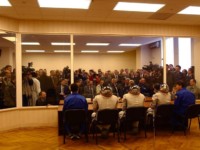 The crew of the Soyuz TM34 answer a barrage of questions from members of the international press at a press conference held before the launch.