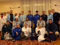 It takes this many people to dress the three men in their space suits.